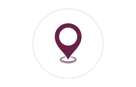 Icon: stilisierte Positionsmarke (Standort-Pin) in dunklem Rot mit Kreisöffnung, darunter eine angedeutete Bodenmarkierung, Symbol für Anschrift und Adresse